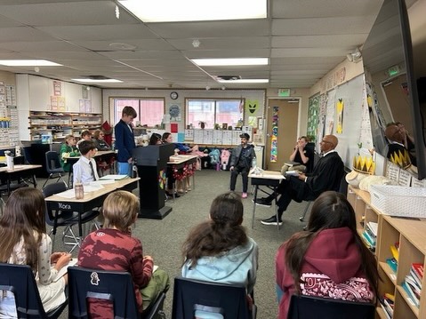 The judge listens intently as students make their case for the big bad wolf.